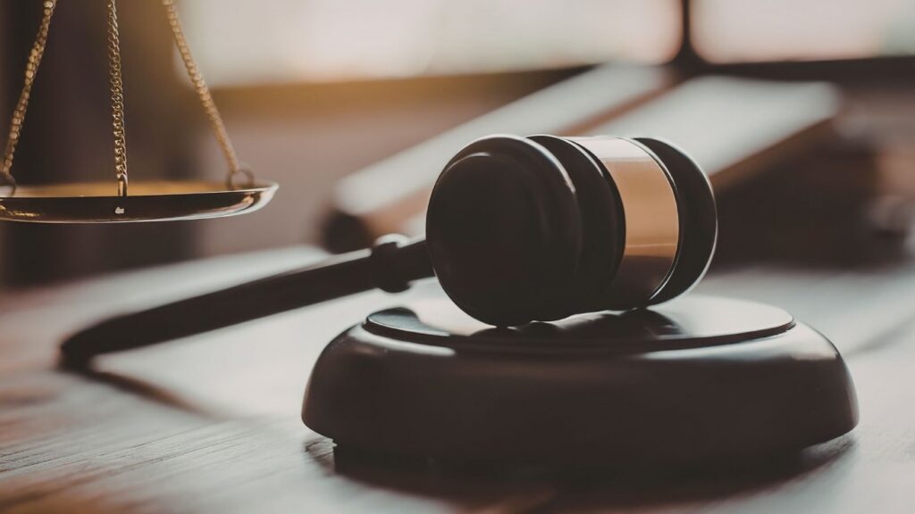 A gavel and scales of justice representing the fight for fairness and equity in Virginia's criminal legal system.